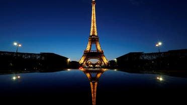 FILE PHOTO: A night view shows the Eiffel tower, reflected in a car's roof, in Paris, France, April 30, 2016. REUTERS/Christian Hartmann/File Photo