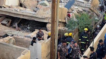 Rescuers work at the site of a four-storey residential building collapse in Amman, Jordan September 13, 2022. (Reuters)