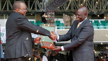 Kenya’s President William Ruto (right) receives instruments of his power and authority from his predecessor Uhuru Kenyatta during his swearing-in ceremony in Nairobi, Kenya, on September 13, 2022. (Reuters)