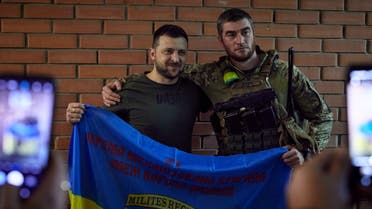 Ukraine's President Volodymyr Zelenskiy poses for a picture with a soldier as he visits a position of Ukrainian service members, while Russia's attack on Ukraine continues, in Soledar, Donetsk region, Ukraine June 5, 2022. (File photo: Reuters)