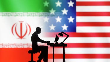 Figurines with computers are seen in front of USA and Iran flags in this illustration taken, September 10, 2022. (Reuters)