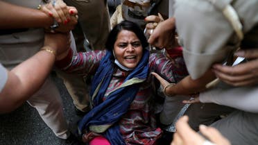A supporter of India’s main opposition Congress party is detained by police during a protest after the death of a rape victim, in front of Uttar Pradesh state bhawan (building) in New Delhi, India, September 30, 2020. (Reuters)