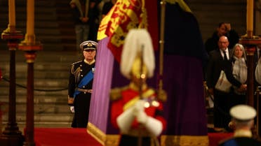 Britain’s Prince Andrew, Duke of York attends a a vigil with his siblings around the coffin of Queen Elizabeth II, draped in the Royal Standard with the Imperial State Crown and the Sovereign’s orb and scepter, lying in state on the catafalque in Westminster Hall, at the Palace of Westminster in London on September 16, 2022, ahead of her funeral on Monday. (Pool/AFP)