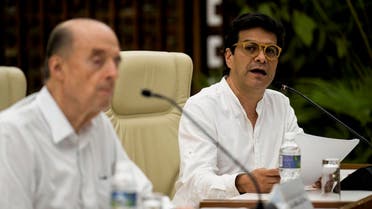 Colombia’s High Peace Commissioner Ivan Danilo Rueda (R) reads a statement next to Colombia’s Foreing Minister Alvaro Leyva Duran, during a meeting with a delegation of Colombia’s leftist National Liberation Army (ELN) rebel group, lead by commander Pablo Beltran (out of frame), in Havana, on August 12, 2022. (AFP)