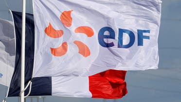 A flag with the company logo of Electricite de France (EDF) and a French flag fly next to the EDF power plant in Bouchain, near Valenciennes, France, September 29, 2021. (File Photo: Reuters)