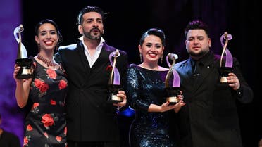 Winners of the Stage Tango Style category Argentine dancers Constanza Vieyto (L) and Ricardo Astrada (2nd L), pose with winners of the Pista Tango Style category Argentine dancers Cynthia Palacios (2nd R) and Sebastian Bolivar during the World Tango Championship final in Buenos Aires, Argentina on September 17, 2022. (AFP)