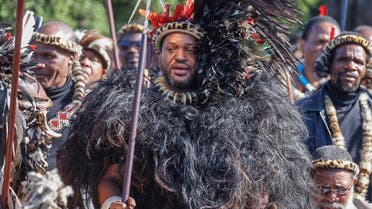 King of Amazulu nation Misuzulu kaZwelithini (C) holds a spear as he sings with Amabutho (Zulu regiments) during his coronation at the KwaKhangelamankengane Royal Palace in Kwa-Nongoma 300km north of Durban on August 20, 2022. (AFP)
