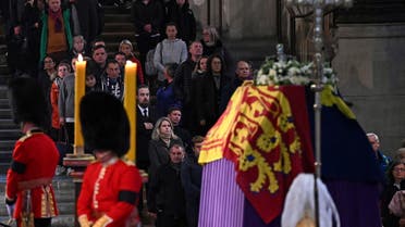 Members of the public pay their respects as they pass the coffin of Queen Elizabeth II, Lying in State inside Westminster Hall, at the Palace of Westminster in London on September 18, 2022. (Reuters)