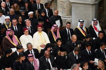 Guests including Saudi Arabia's Prince Turki bin Mohammed (center left) and Jordan's King Abdullah (front left) take their seats inside Westminster Abbey in London on September 19, 2022, for the State Funeral Service for Britain's Queen Elizabeth II. (AFP)