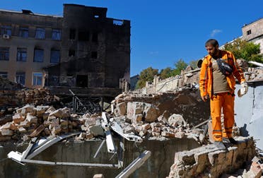 A man stands on the ruins of a building destroyed by recent shelling during Russia-Ukraine conflict in the city of Kadiivka (Stakhanov) in the Luhansk region, Ukraine September 19, 2022. (Reuters)