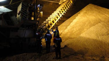 A file picture taken on May 28, 2013, shows employees working at the Uralkali, Russian potash fertilizer company, in the Urals city of Berezniki, more than 1,200 kilometres east of Moscow. (AFP)