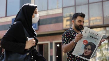 A man views a newspaper with a cover picture of Mahsa Amini, a woman who died after being arrested by the Islamic Republic’s morality police in Tehran, Iran, on September 18, 2022. (Reuters)