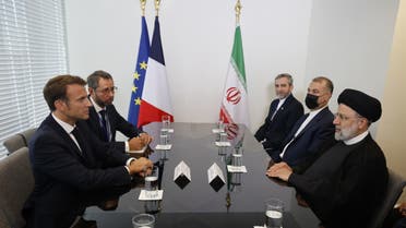 French President Emmanuel Macron (L) holds a bilateral meeting with Iranian President Ebrahim Raisi on the sidelines of the 77th United Nations General Assembly at UN headquarters in New York City on September 20, 2022. (AFP)