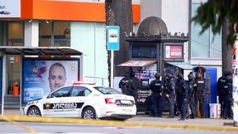 Armed man takes 12 hostages at bank in Georgia