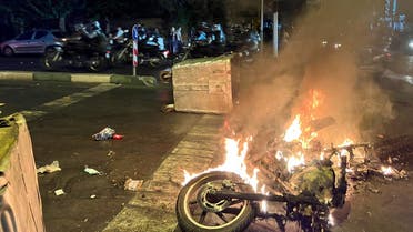 A police motorcycle burns during a protest over the death of Mahsa Amini, a woman who died after being arrested by the Islamic Republic’s morality police, in Tehran, Iran, on September 19, 2022. (Reuters)