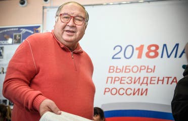 Russian businessman Alisher Usmanov casts his ballot at a polling station during Russia's presidential election in Moscow on March 18, 2018. (AFP)