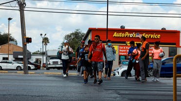 Migrants walk outside the City of San Antonio Migrant Resource Center, where two planeloads of mostly Venezuelan migrants sent via Florida to Martha's Vineyard in Massachusetts had originated, in San Antonio, Texas, US September 16, 2022. (Reuters)