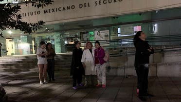 People wait outside their homes after a tremor was felt in Mexico City, Mexico, on September 22, 2022. (Reuters)