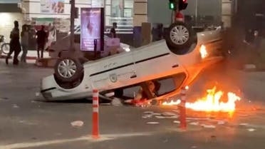 An overturned police car is seen on fire in Bojnurd, Iran, September 22, 2022 in this screengrab obtained from social media video. Video obtained by Reuters/via REUTERS THIS IMAGE HAS BEEN SUPPLIED BY A THIRD PARTY. MANDATORY CREDIT. NO RESALES. NO ARCHIVES.