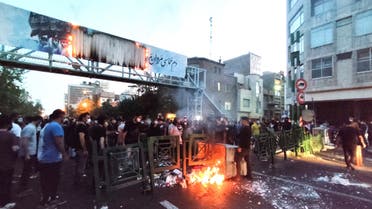 People light a fire during a protest over the death of Mahsa Amini, a woman who died after being arrested by the Islamic republic's morality police, in Tehran, Iran September 21, 2022. (Reuters)
