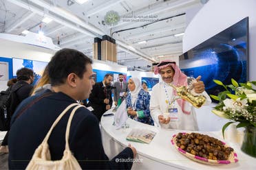 Visitors at the Saudi Space Commission's pavilion at IAC 2022 in Paris, France. (Twitter)