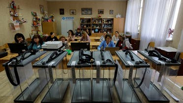 Members of the local electoral commission gather at a polling station ahead of the planned referendum on the joining of the self-proclaimed Donetsk people's republic to Russia, in Donetsk, Ukraine September 22, 2022. (Reuters)