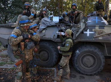 Ukrainian soldiers have a break on their way to the frontline against Russian troops in the Donetsk region on September 21, 2022. (AFP)