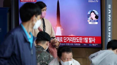 People watch a TV broadcasting a news report on North Korea firing a ballistic missile towards the sea off its east coast, in Seoul, South Korea, September 25, 2022. (Reuters)