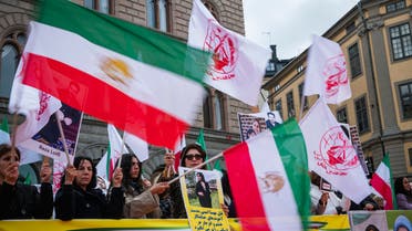 People protest outside the Swedish Parliament in Stockholm, Sweden, on September 24, 2022, following the death of an Iranian woman after her arrest by the country's morality police in Tehran. (AFP)