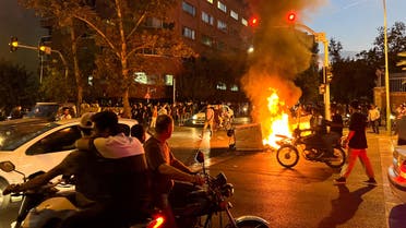 A police motorcycle burns during a protest over the death of Mahsa Amini, a woman who died after being arrested by the Islamic republic's morality police, in Tehran, Iran September 19, 2022. (Reuters)