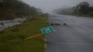 A fallen road sign and branches are pictured on a highway after Hurricane Ian made landfall in Cuba's Pinar del Rio province earlier, in Consulacion del Sur, Cuba September 27, 2022. (Reuters)