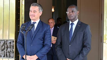 French Interior Minister Gerald Darmanin (L) speaks next to Ivorian Security and Interior Minister Vagondon Diomande (R)after a meeting with president Alassane Ouattara at the presidential palace in Abidjan on September 27, 2022. (AFP)