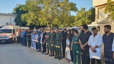 An ambulance, with the Syrian Red Crescent, is pictured at a hospital in Tartus on September 23, 2022, before transferring the bodies of the shipwrecked Lebanese, who drowned when a boat they boarded sank off Syria’s coast, back to Lebanon. (AFP)
