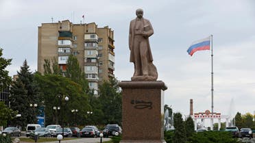 A view shows a monument to Ukrainian poet Taras Shevchenko with the Russian flag flying in the background during a five-day referendum on the secession of Zaporizhzhia region from Ukraine and its joining Russia, in the Russian-controlled city of Melitopol in the Zaporizhzhia region, Ukraine September 26, 2022. (Reuters)