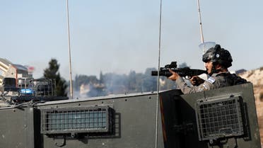  A member of the Israeli forces aims with a gun during a protest near the Jewish settlement of Beit El, near Ramallah, in the Israeli-occupied West Bank November 11, 2021. (File photo: Reuters)