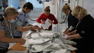 Members of a local electoral commission count ballots at a polling station following a referendum on the joining of Russian-controlled regions of Ukraine to Russia, in Sevastopol, Crimea September 27, 2022. (Reuters)