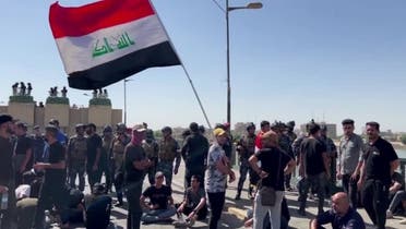 A screen grab from a video shows protesters gathering on Republic Bridge and in Baghdad’s Tahrir Square amid intense security forces deployment, Baghdad, Iraq, September 28, 2022. (Reuters)