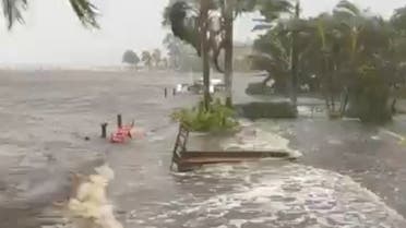 A general view of docks damaged due to high waves, wind and rain on the banks of the Caloosahatchee River as Hurricane Ian makes landfall in southwestern Florida, in Fort Myers, Florida, US, on September 28, 2022, in this still image obtained from a social media video. (Reuters)
