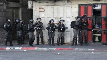 Israeli soldiers are pictured during clashes with Palestinian demonstrators in the area of Bab al-Zawiya in the centre of the city of Hebron in the occupied West Bank on September 29, 2022. (AFP)