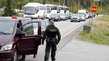 Finnish border guards check a Russian vehicle at the Vaalimaa border check point in Virolahti, Finland, on September 25, 2022. (Reuters)