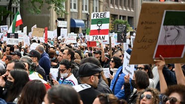 People demonstrate during a protest for Mahsa Amini who died in custody of Iran's morality police, in Montreal, Quebec, Canada, on October 1, 2022. (AFP)