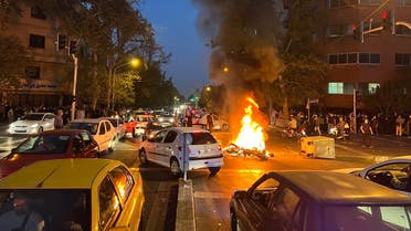 A motorbike burning in the middle of an intersection during protests for Mahsa Amini, a woman who died after being arrested by the Islamic republic’s “morality police,” in Tehran on September 19, 2022. (AFP)