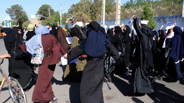 Afghan female students chant Education is our right, genocide is a crime during a protest as they march from the University of Herat toward to the provincial governor office in Herat on October 2,2022, two days after a suicide bomb attack in a learning center in Kabul. (AFP)