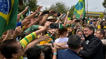 Brazil’s President and candidate for re-election Jair Bolsonaro greets supporters in Pocos de Caldas, Minas Gerais state, Brazil, September 30, 2022. REUTERS/Washington Alves