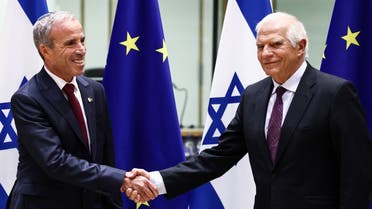European Commission vice-president in charge for High-Representative of the Union for Foreign Policy and Security Policy Josep Borrell (R) shakes hands with Israeli Intelligence Minister Elazar Stern (L) before an EU-Israel Association Council at the European Council in Brussels, on Octobre 3, 2022. (AFP)