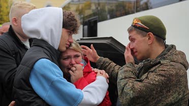 A Russian reservist bids farewell to relatives before his departure for a base in the course of partial mobilization of troops, aimed to support the country’s military campaign in Ukraine, in the town of Gatchina in Leningrad Region, Russia, on October 1, 2022. (Reuters)