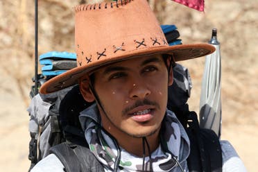 Saudi trekker Abdullah Alsulmi crosses a desert area near al-Khasrah area, some 350Km west of Riyadh, on Septembre 27, 2022, during his solo trek to the Qatari capital ahead of the FIFA World Cup. (AFP)