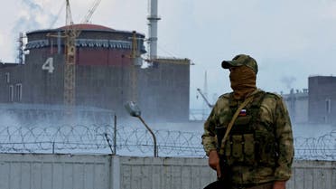 A serviceman with a Russian flag on his uniform stands guard near the Zaporizhzhia Nuclear Power Plant in the course of Ukraine-Russia conflict outside the Russian-controlled city of Enerhodar in the Zaporizhzhia region, Ukraine August 4, 2022. (File Photo: Reuters)