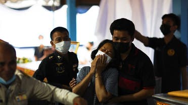 Relatives react after identifying the body of a loved one at Sri Uthai temple in Na Klang district, following a mass shooting in the town of Uthai Sawan in the province of Nong Bua Lam Phu, Thailand, on October 7, 2022. (Reuters)