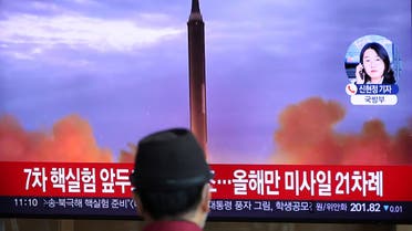 A man watches a TV broadcasting a news report on North Korea firing a ballistic missile over Japan, at a railway station in Seoul, South Korea, October 4, 2022. REUTERS/Kim Hong-Ji